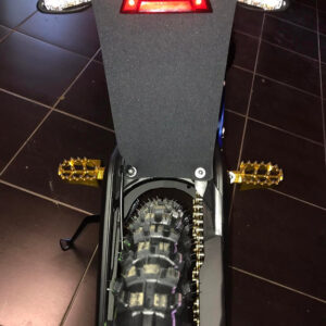 Rear light and turn signal holder under the seat on Sur-Ron L1e